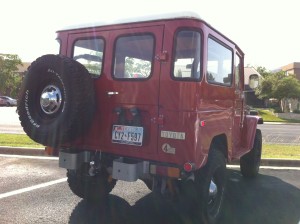 Red Vintage Land Cruiser in Austin rear