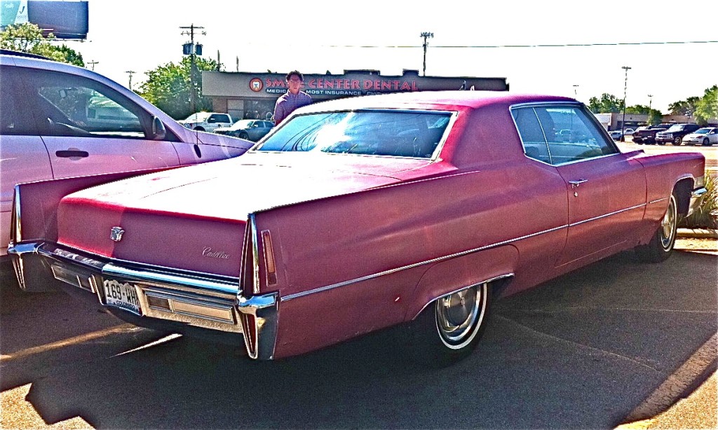 Red 1970 Cadillac Coupe De Ville  side view