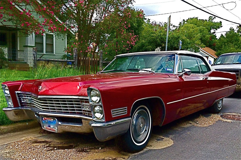 Red 1967 Cadillac Convertible in Zilker front quarter
