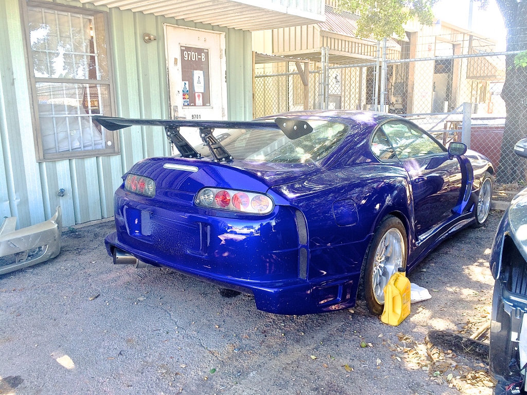 Modified Toyota Supra with large wing in Austin TX